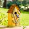 Glitzhome® 9.75" Yellow Distressed Bird & Tree Birdhouse
